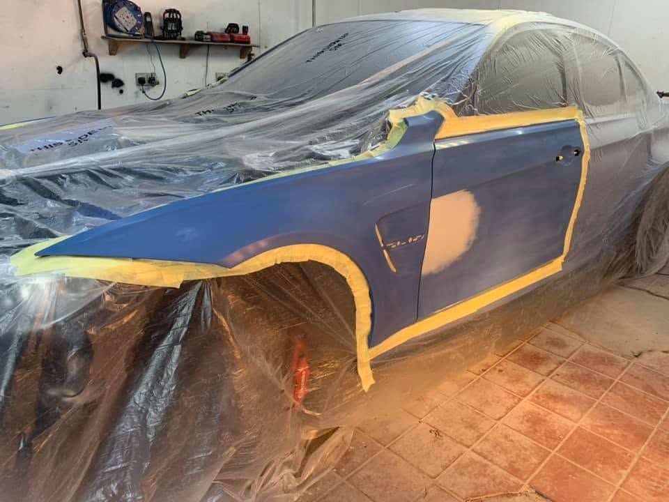 BMW M3 masked up and in primer, ready for spraying in the booth at MK Auto Repairs in Edinburgh