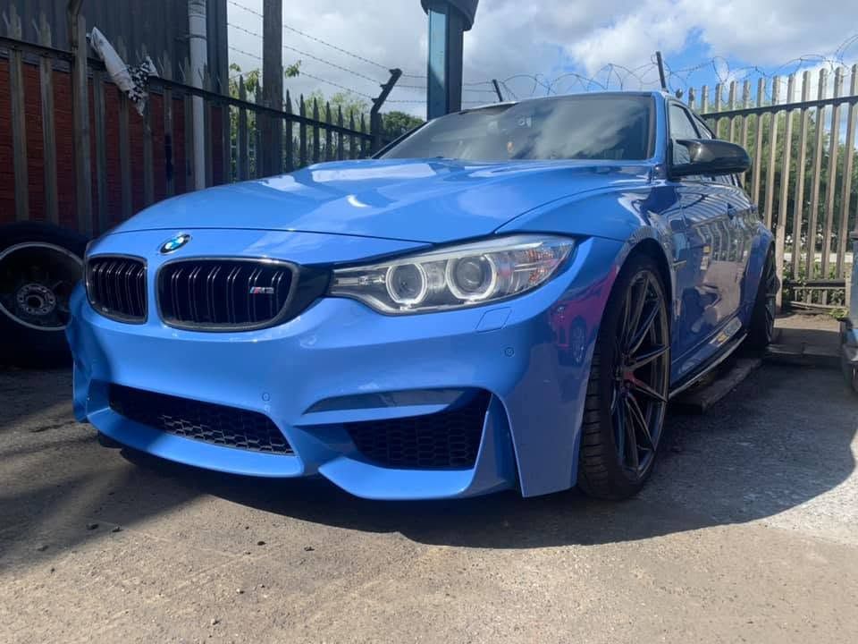 Completed BMW M3 respray parked outside the MK Auto Repairs workshop in daylight