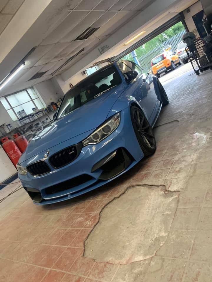 Blue BMW M3 in the workshop at MK Auto Repairs with the new colour laid down