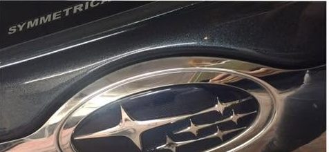 The same Subaru boot lid after the corrosion was cut out and the panel refinished, with a clean even edge