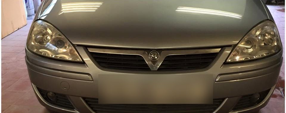 The same Vauxhall Corsa after repair, with the bumper, wing and headlight back in line and the paint even across the front